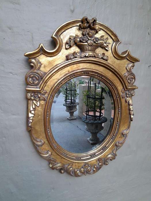 A 20th Century Carved and Gilded Bevelled Oval Mirror