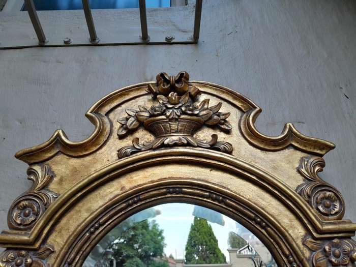 A 20th Century Carved and Gilded Bevelled Oval Mirror