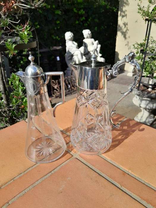 A 20th Century Set of Two Claret Jugs with EPNS Handles and Lids