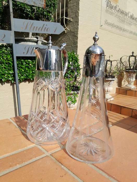 A 20th Century Set of Two Claret Jugs with EPNS Handles and Lids