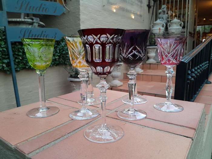 A 20th Century Collection Of Seven Coloured Bohemian Cut Crystal Wine Glasses