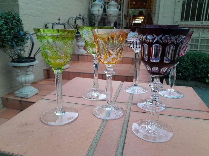 A 20th Century Collection Of Seven Coloured Bohemian Cut Crystal Wine Glasses