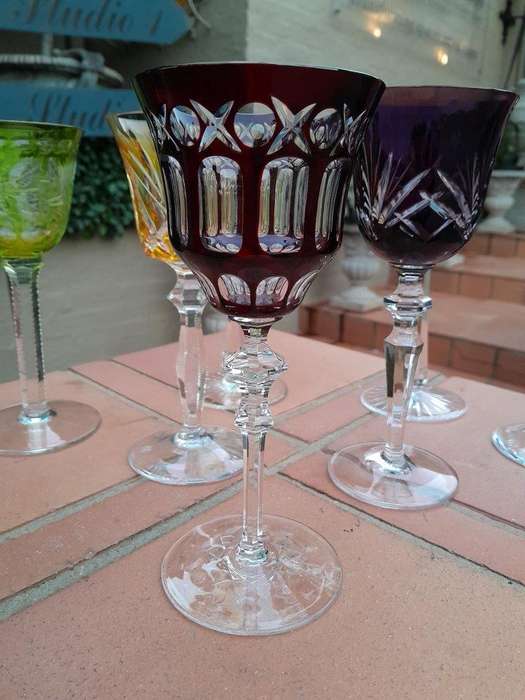 A 20th Century Collection Of Seven Coloured Bohemian Cut Crystal Wine Glasses