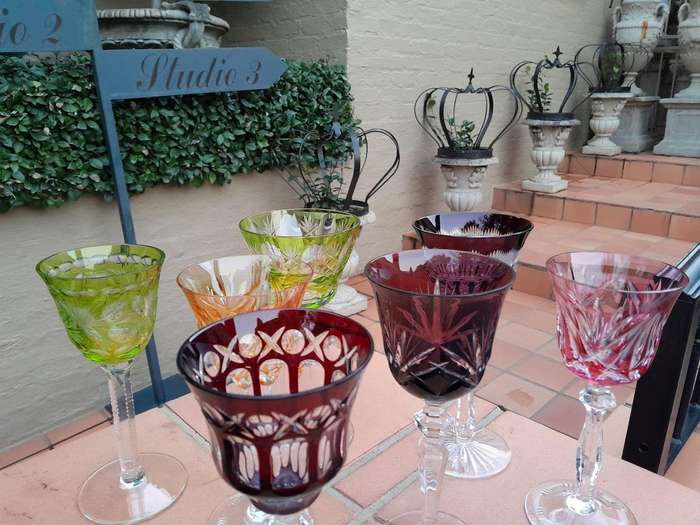 A 20th Century Collection Of Seven Coloured Bohemian Cut Crystal Wine Glasses