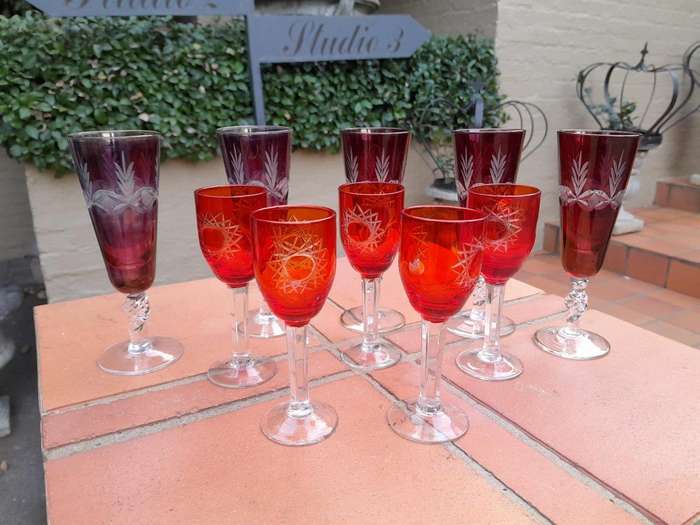 A 20th Century Collection Of Eleven Bohemian Cut Crystal Champagne And Sherry Glasses