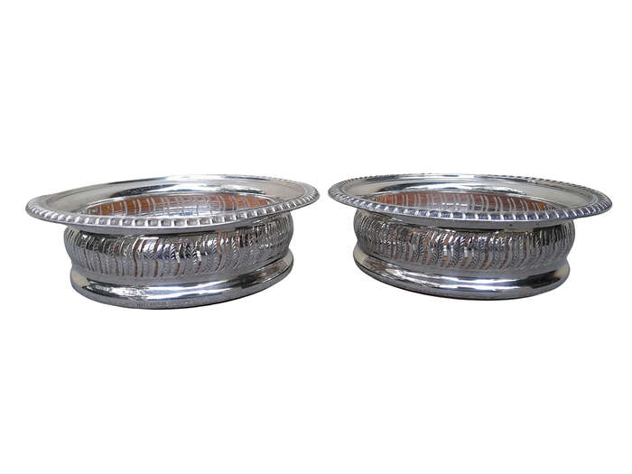 A 20th Century Pair Of Mappin & Webb Silver Plated Wine Coasters