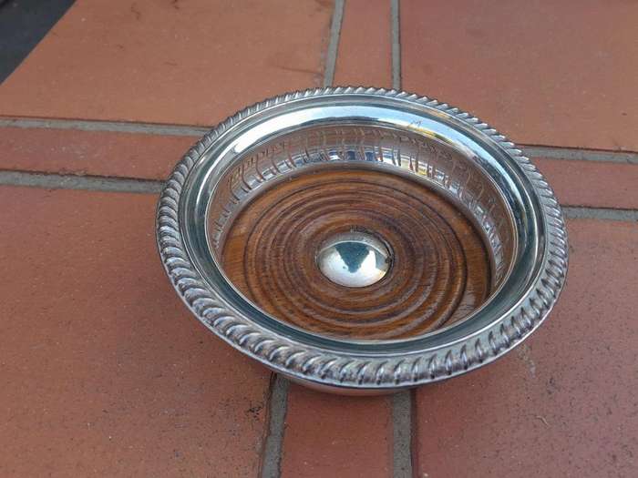 A 20th Century Pair Of Mappin & Webb Silver Plated Wine Coasters