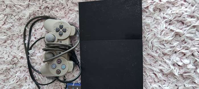 Playstation 2 with remote and game