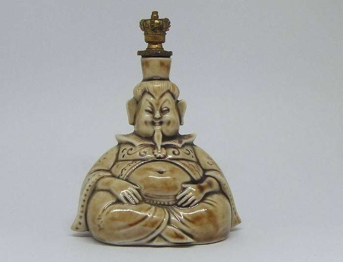 An extremely rare 1920`s German figural perfume bottle with crown top by Schafer & Vater