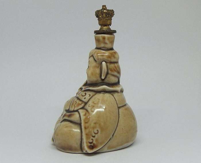 An extremely rare 1920`s German figural perfume bottle with crown top by Schafer & Vater