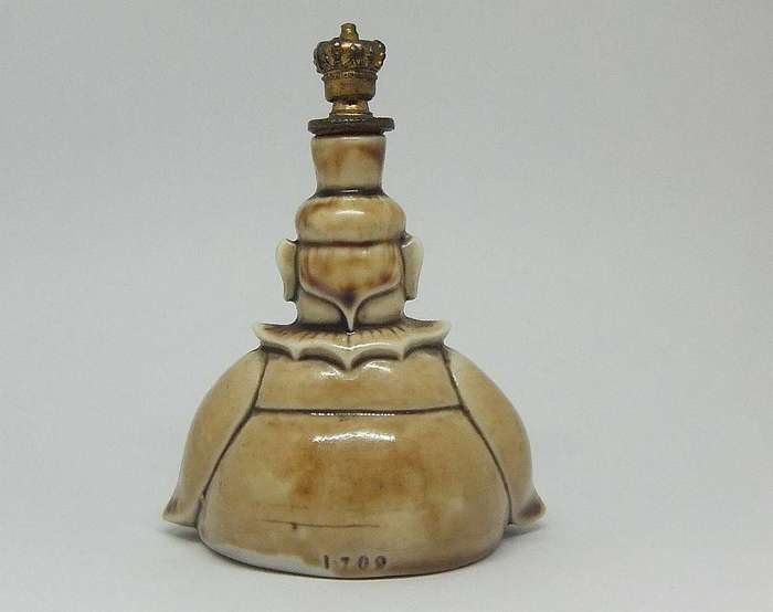 An extremely rare 1920`s German figural perfume bottle with crown top by Schafer & Vater