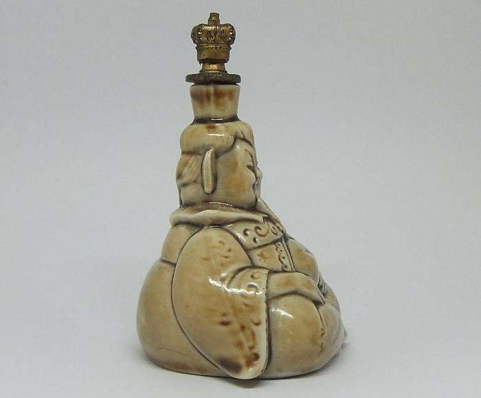 An extremely rare 1920`s German figural perfume bottle with crown top by Schafer & Vater