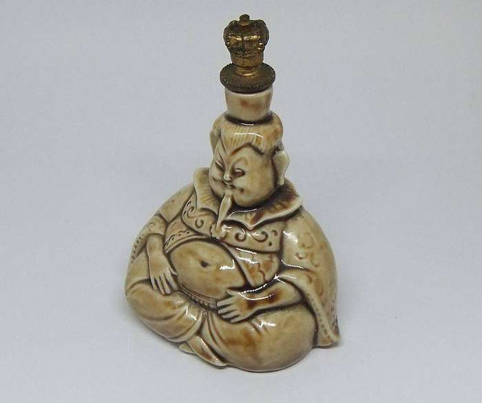 An extremely rare 1920`s German figural perfume bottle with crown top by Schafer & Vater