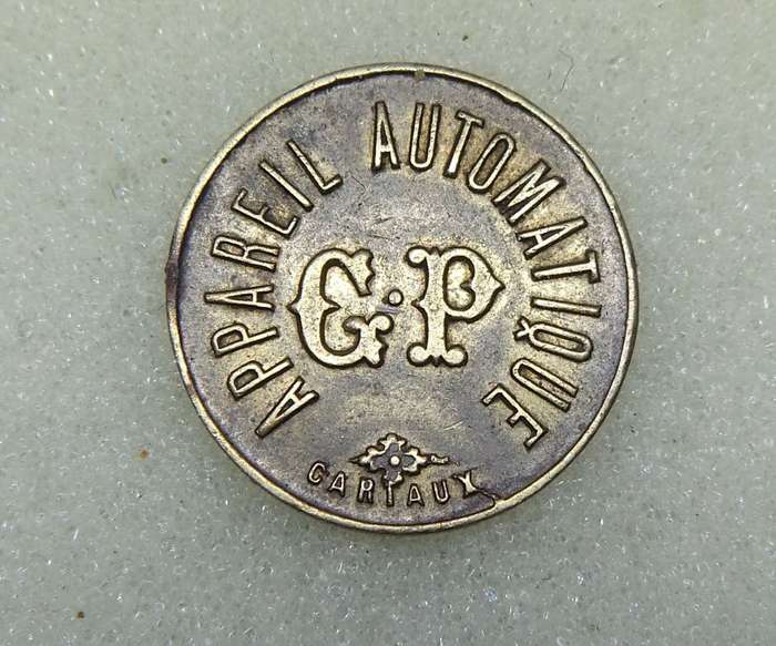 AN OLD 20 CENTIMES FRENCH CONSUMER TOKEN