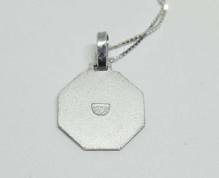 A vintage sterling silver Cancer Zodiac sign pendant plus a sterling silver necklace