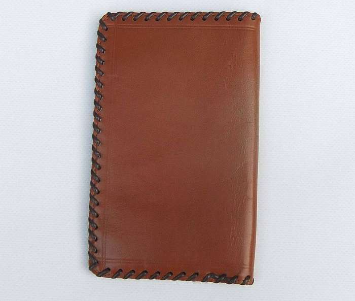 A vintage genuine leather pocket organiser with Africa motif in unused condition