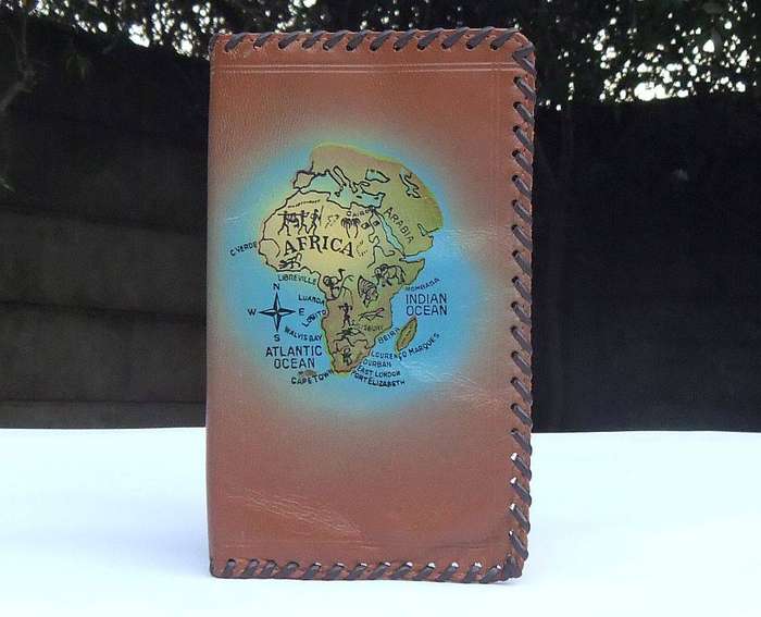 A vintage genuine leather pocket organiser with Africa motif in unused condition