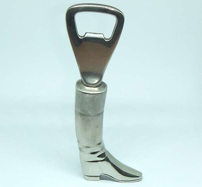 A VINTAGE SOLID METAL BOOT FORM BOTTLE OPENER
