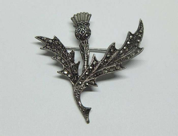 A vintage solid sterling silver South African designer Scottish Thistle brooch with marcasite