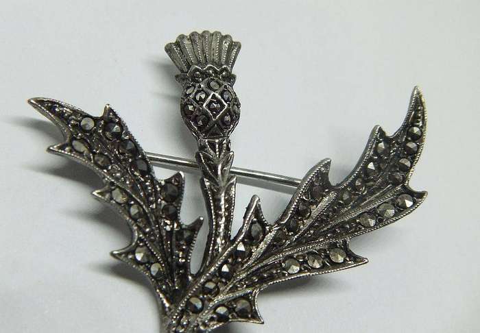 A vintage solid sterling silver South African designer Scottish Thistle brooch with marcasite