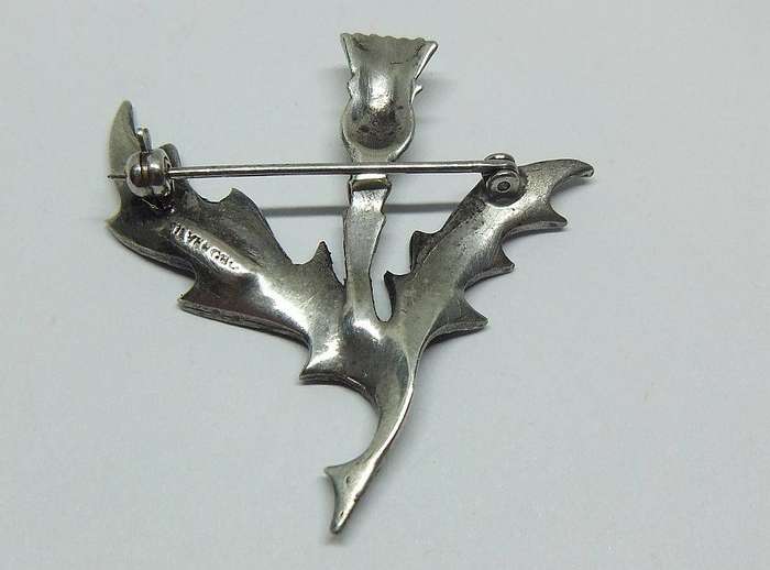 A vintage solid sterling silver South African designer Scottish Thistle brooch with marcasite