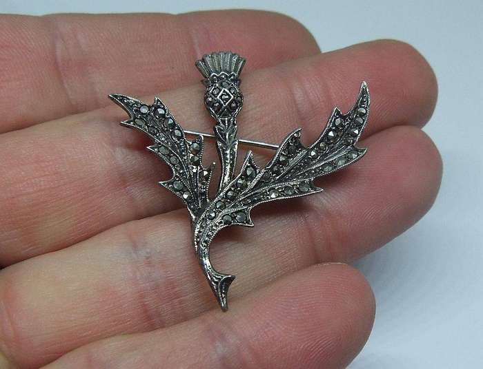A vintage solid sterling silver South African designer Scottish Thistle brooch with marcasite