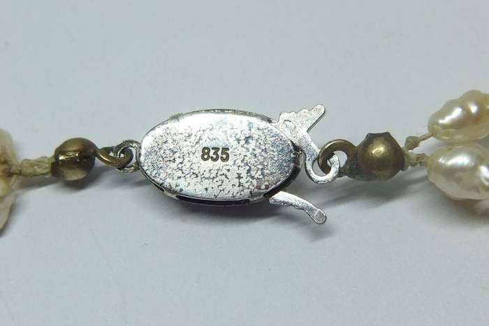 A vintage triple strand genuine Freshwater seed pearl necklace with 835 German silver clasp