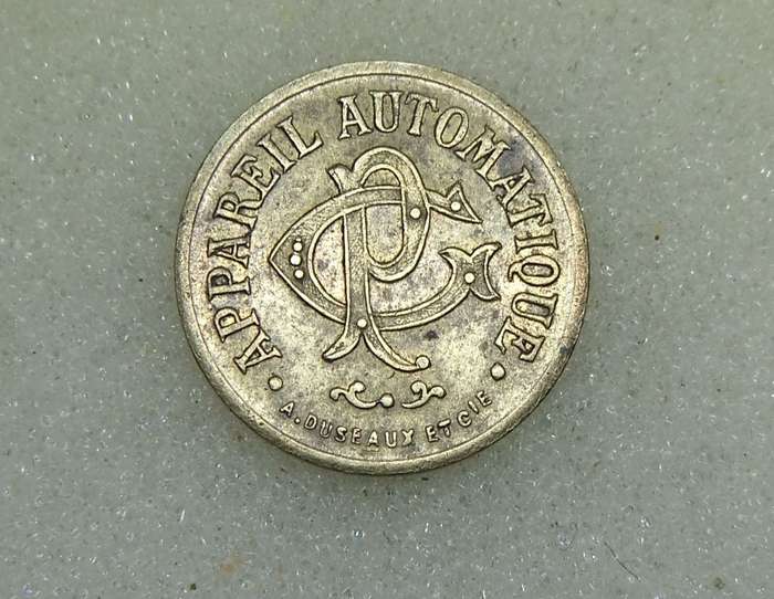 AN ANTIQUE FRENCH 20 CENTIMES CONSUMER TOKEN