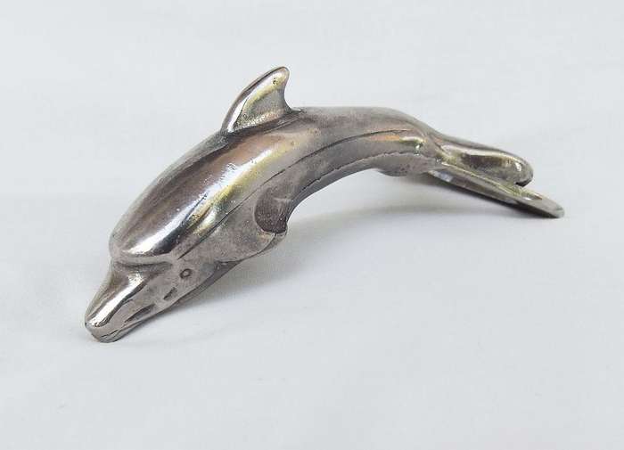 AN ADORABLE SOLID METAL VINTAGE DOLPHIN MOTIF BOTTLE OPENER WITH DESIGNER STAMP !!