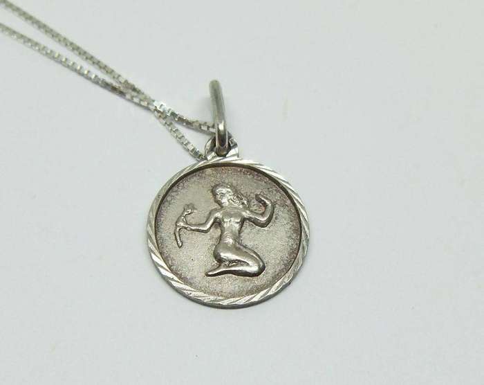 A detailed vintage sterling silver Virgo Zodiac pendant with sterling silver necklace