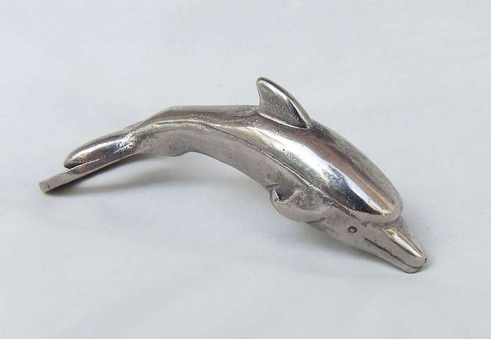 AN ADORABLE SOLID METAL VINTAGE DOLPHIN MOTIF BOTTLE OPENER WITH DESIGNER STAMP !!