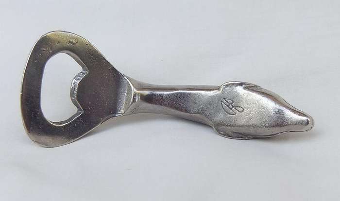 AN ADORABLE SOLID METAL VINTAGE DOLPHIN MOTIF BOTTLE OPENER WITH DESIGNER STAMP !!