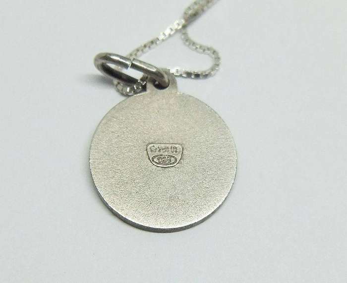 A detailed vintage sterling silver Virgo Zodiac pendant with sterling silver necklace