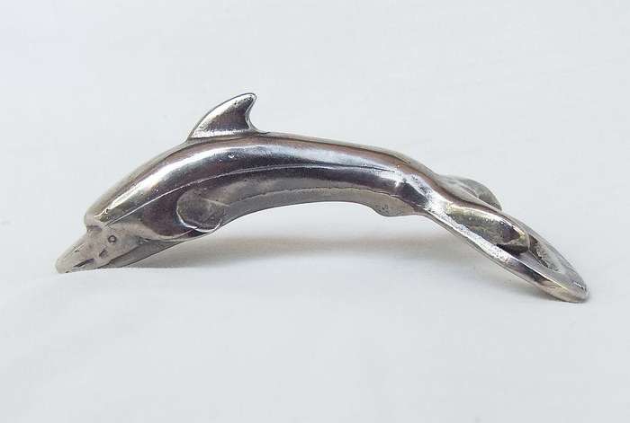 AN ADORABLE SOLID METAL VINTAGE DOLPHIN MOTIF BOTTLE OPENER WITH DESIGNER STAMP !!