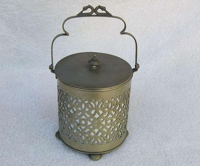 A VICTORIAN ERA PORCELAIN JAR WITH METAL FRAME , HANDLE AND LID MARKED EPNS