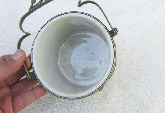 A VICTORIAN ERA PORCELAIN JAR WITH METAL FRAME , HANDLE AND LID MARKED EPNS