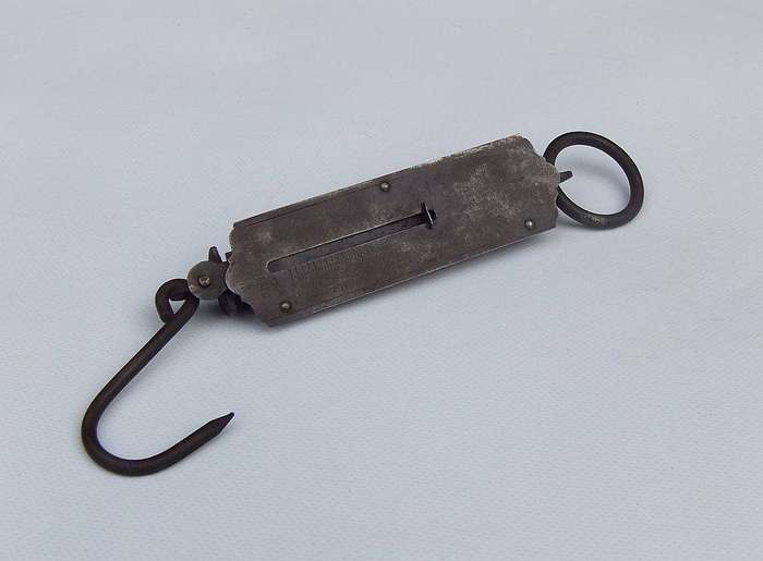 An old pocket balance scale made in Germany