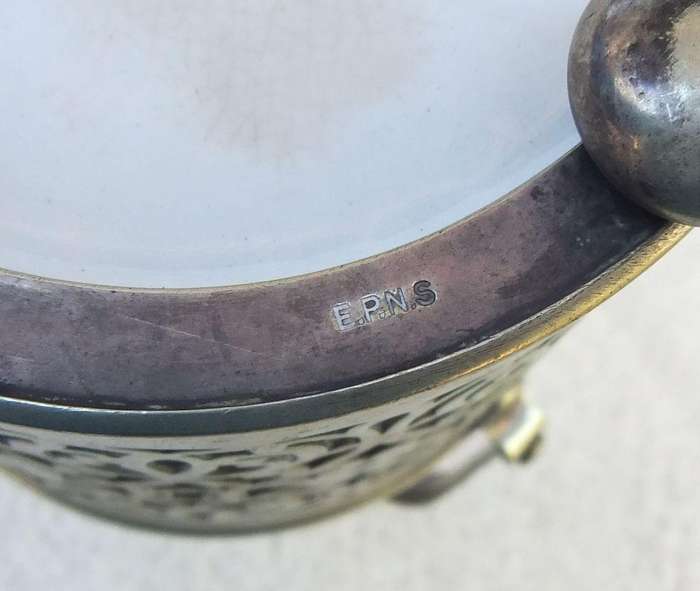A VICTORIAN ERA PORCELAIN JAR WITH METAL FRAME , HANDLE AND LID MARKED EPNS