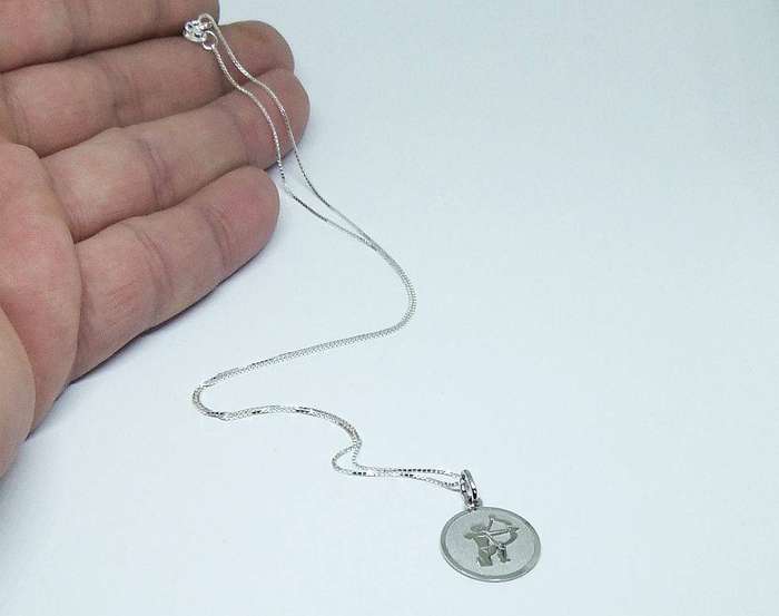 A vintage sterling silver Sagittarius Zodiac sign pendant with a sterling silver necklace