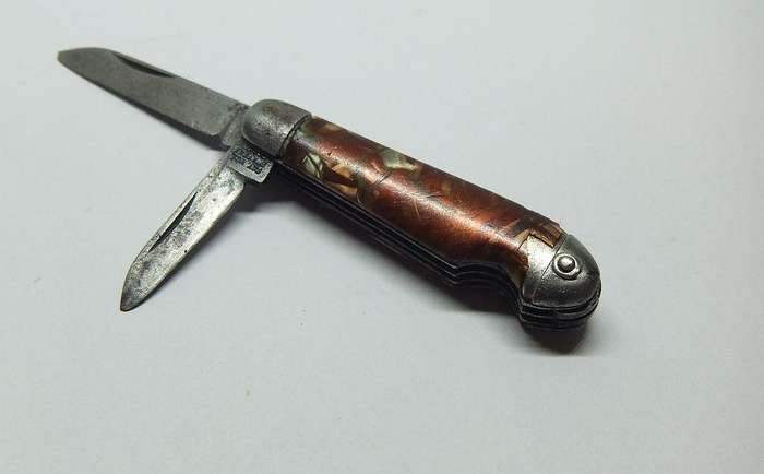 A VERY OLD TICKEY POCKET SIZED KNIFE TOOL USED FOR CLEANING SMOKING PIPES IN THIS CASE ...TOO CUTE !