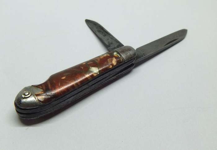 A VERY OLD TICKEY POCKET SIZED KNIFE TOOL USED FOR CLEANING SMOKING PIPES IN THIS CASE ...TOO CUTE !