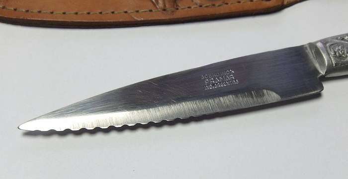 A rare vintage detailed Argentinian Gaucho knife with genuine leather pouch depicting a stag