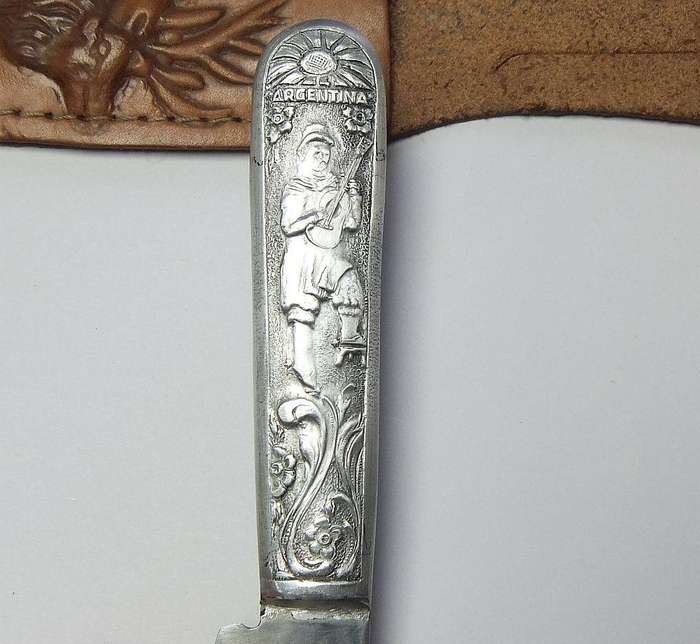 A rare vintage detailed Argentinian Gaucho knife with genuine leather pouch depicting a stag
