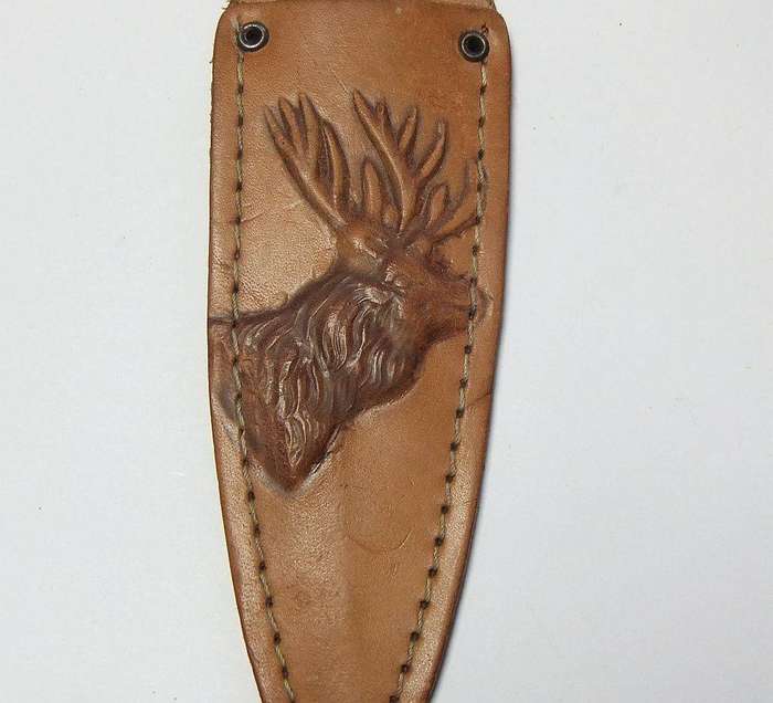 A rare vintage detailed Argentinian Gaucho knife with genuine leather pouch depicting a stag