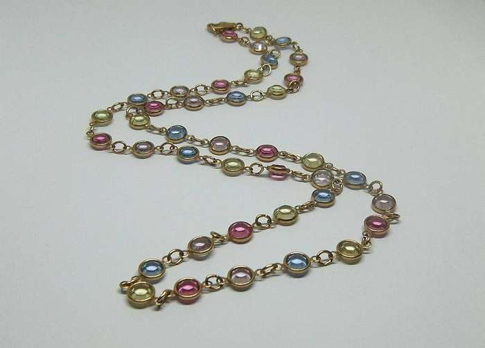 A stunning vintage gold plated necklace with faceted coloured glass insets