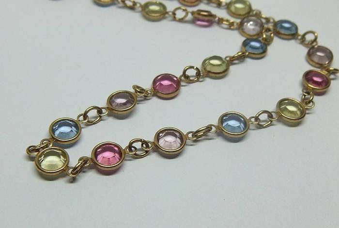 A stunning vintage gold plated necklace with faceted coloured glass insets