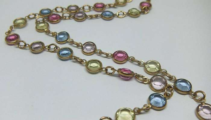 A stunning vintage gold plated necklace with faceted coloured glass insets