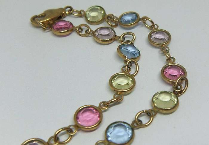 A stunning vintage gold plated necklace with faceted coloured glass insets