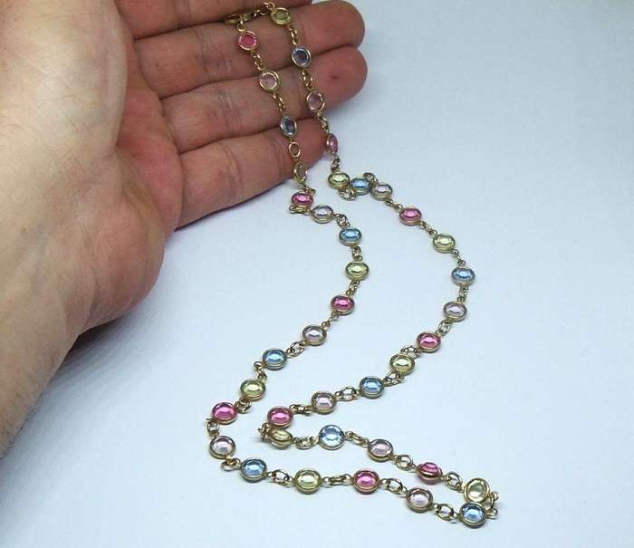 A stunning vintage gold plated necklace with faceted coloured glass insets