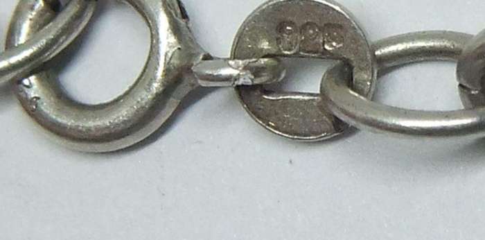 A VERY COOL VINTAGE STERLING SILVER CHARM BRACELET WITH VARIOUS DEGREES OF SILVER CHARMS , JUST LOOK